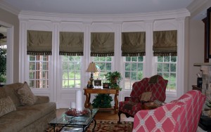 This grouping of shades continues the rhythm of the windows. They are made from silk dupioni, lined and interlined and have a custom skirt design along the bottom. We also inserted some exquisite trim from South Africa where the skirt begins. Yummy!