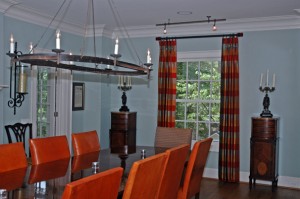 This is a stunning dining room with some unique iron work in the chandelier and the candle sticks. In keeping with that style, we selected iron hardware from Helser Brothers with custom designed finials. We used the same rod and finials in the adjacent piano room