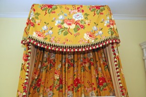 This canopy was created from the Melody Valence that was in her room in her first home. We kept the basic shape at the center of the valence, added some pleats at the corner and attached gathered drapery panels to the back and sides of the canopy.
