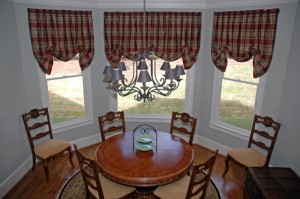 This shade design pairs well with plaid fabric to create a softer silhouette. The shade has about 2.5 times fullness in the shirring at the top. We mounted the shade to a dust board and then attached the braided twist cord.