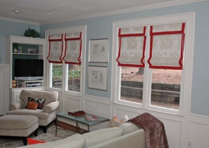 This fabric has a dragon motif woven within. We wanted to bring some red accents into this room that uses Restoration Hardware paint color Silver Sage. To do that, we added a 2-1/2" banding along the edges and bottom of the shades and the valence. It creates a harmonious look to the room and gives us the red we so desire.
