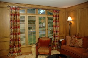 These draperies are lined and interlined in luxurious embroidered silk. They have button detailing at the pleat and are masculine enough for a man's study. The reeded pole and hammered steel rings are from The Finial Company.