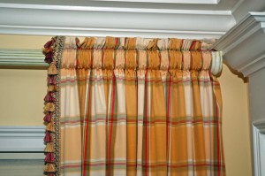 These drapery panels are lined and interlined. They are closely shirred on the decorative drapery rod to create fullness.