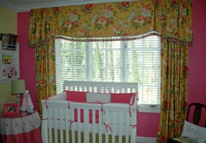 This room was first designed for a little girl with the idea that she could grow up with these window treatments. We designed the bumpers for her crib, the seer sucker bedskirt, a table skirt and pillows.