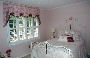 This little girl wanted a princess room and who doesn't at that age? So we created a swag, horn & cascade treatment that included some fuss but not too much. The bottom edge of the treatment has a cordinating popcorn fringe, the bed has a monogrammed pillow and a lumbar pillow in pink toille with brushed fringe.