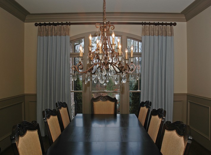 These panel have a double cuff-top fabricated from a silk & golden metallic fabric. The body of the panel is a robin's egg blue and contrasts beautifully with the two toned brown wall and judges paneling in this elegant dining room. Home is in the Milton/Alpharetta, GA area.