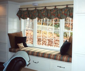 This is a variation on the Izzy Valence in that it has "tab" at the top that are cinched together with a complementary cording. The window cushion is over seven feet long and the homeowner wanted it to be a place where her children would curl up with a book to read or to nap.