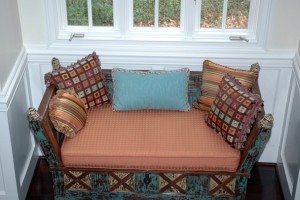 This bench created a focal point as well as a place to rest when going from level to level in this beautiful custom home. The pillows each are detailed with tassel or brushed trims and cording.